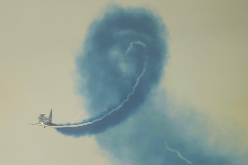 A member of the "August 1st" Aerobatic Team of the Chinese People's Liberation Army (PLA) Air Force performs during the 13th China International Aviation and Aerospace Exhibition, also known as Airshow China 2021, on Tuesday, Sept. 28, 2021 in Zhuhai in southern China's Guangdong province. (AP Photo/Ng Han Guan)