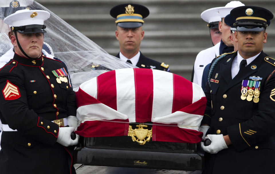 The flag-draped casket of Sen. John McCain, R-Ariz., is carried to a hearse from the U.S. Capitol in Washington, Saturday, Sept. 1, 2018, in Washington, for a departure to the Washington National Cathedral for a memorial service. McCain died Aug. 25 from brain cancer at age 81. (AP Photo/Jose Luis Magana)