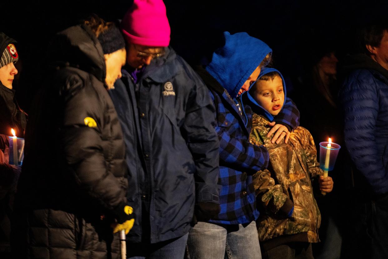 Community members gather as they honor the victims of a shooting at Perry High School Thursday, Jan. 4, 2024, at Wiese Park in Perry.