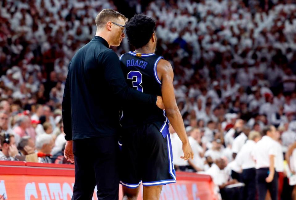 Duke’s head coach Jon Scheyer talks with Jeremy Roach (3) after Roach fouled out during the second half of Arkansas’ 80-75 victory over Duke at Bud Walton Arena in Fayetteville, Ark., Weds. Nov. 29, 2023.