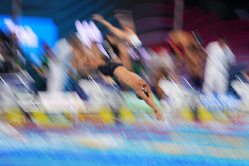 Members of team United States compete during the men's 4x100m freestyle relay final at the 19th FINA World Championships in Budapest, Hungary, Saturday, June 18, 2022. (AP Photo/Petr David Josek)