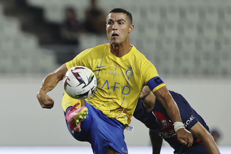 FILE - Al Nassr's Cristiano Ronaldo controls the ball during a friendly soccer match against Paris Saint-Germain in Osaka, western Japan, on July 25, 2023. Ronaldo walked off the field with the gleeful chants of “Messi! Messi!” ringing in his ears from delighted Al-Hilal fans who had just watched their Saudi Pro League team beat the Portugal superstar's Al-Nassr 3-0 in the Riyadh Derby on Friday. (Kyodo News via AP, File)