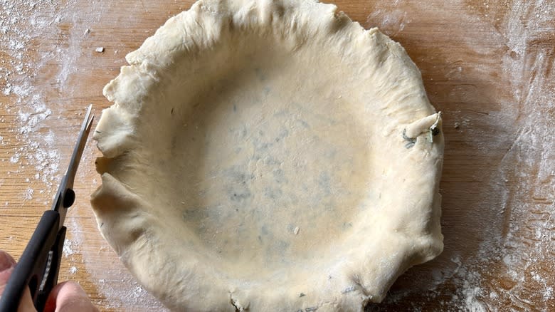 raw pie crust in dish