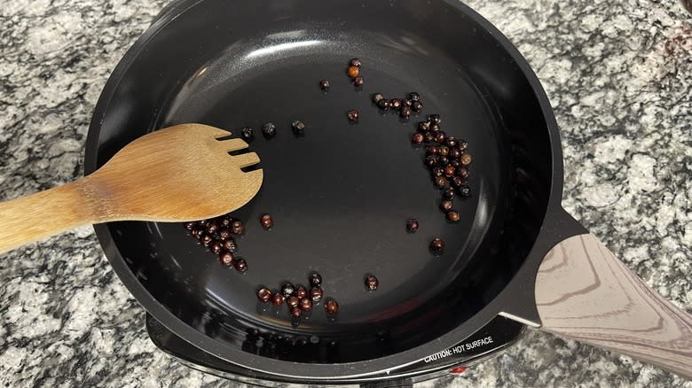 toasting juniper berries in pan