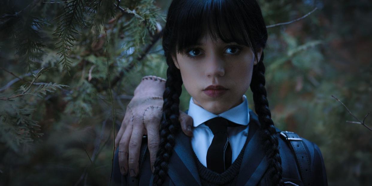 wednesday l to r thing, jenna ortega as wednesday addams in episode 104 of wednesday cr courtesy of netflix © 2022