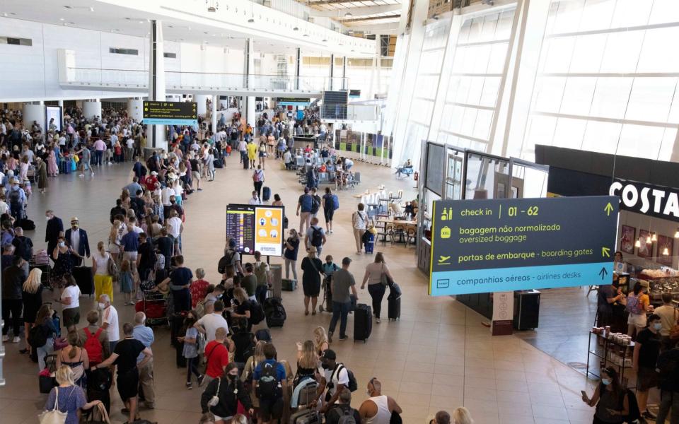 British holidaymakers returning home today before the UK designates Portugal as a Covid amber list country - SOLARPIX.COM 