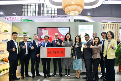 Novozymes President and CEO Ester Baiget (sixth from left), Regional President of Novozymes APAC Lensey Chen (seventh from left) and Angel Yeast Vice President Wang Xishan (fourth from left) joined company employees to celebrate the launch of Yeast Plus.  (PRNews photo/Angel Yeast)