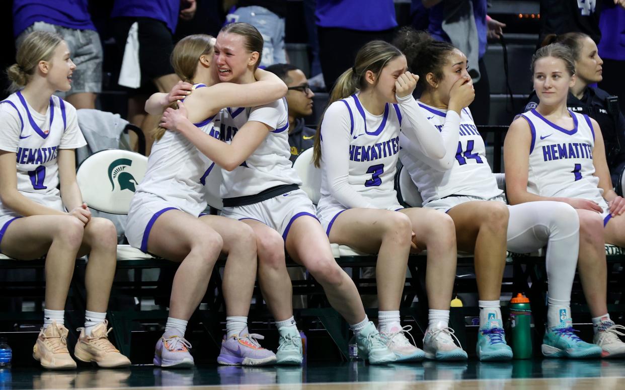 Ishpeming players, including Jenna Maki (1), right, celebrate the 73-54 win over Kingston in the Division 4 girls basketball state final at Breslin Center in East Lansing on Saturday, March 23, 2024.