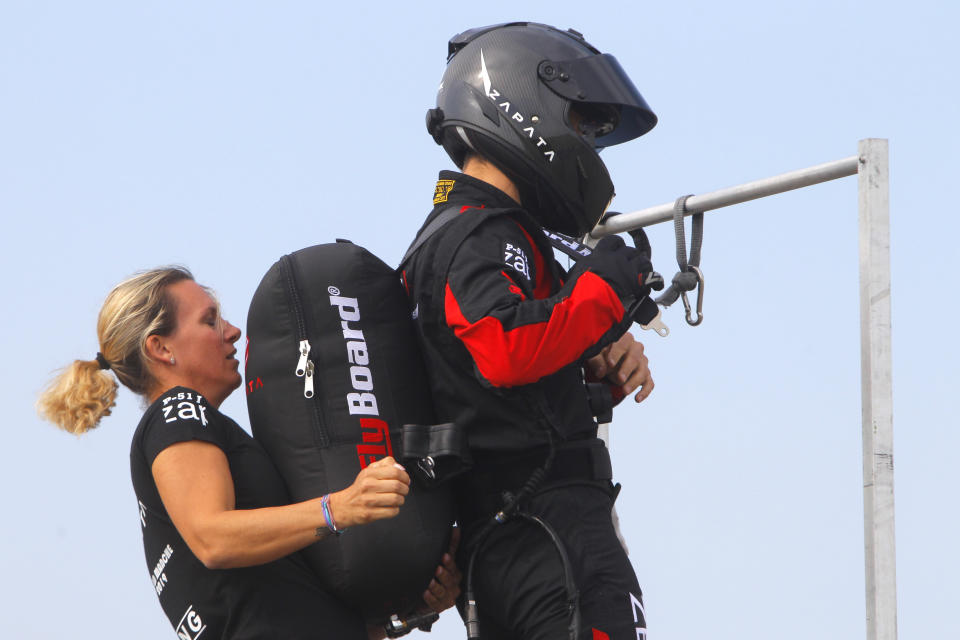 Franky Zapata, "Le Rocketman", a 40-year-old inventor, and his wife, Krysten, prepare a training flight over the Saint Inglevert airport near Calais, Northern France, Wednesday July 24, 2019. On Thursday, Zapata, a 40-year-old inventor, will attempt to fly into the record books by becoming the first person in human history to zoom across the Channel aboard a jet-powered 'hover-board'. (Photo/Michel Spingler)