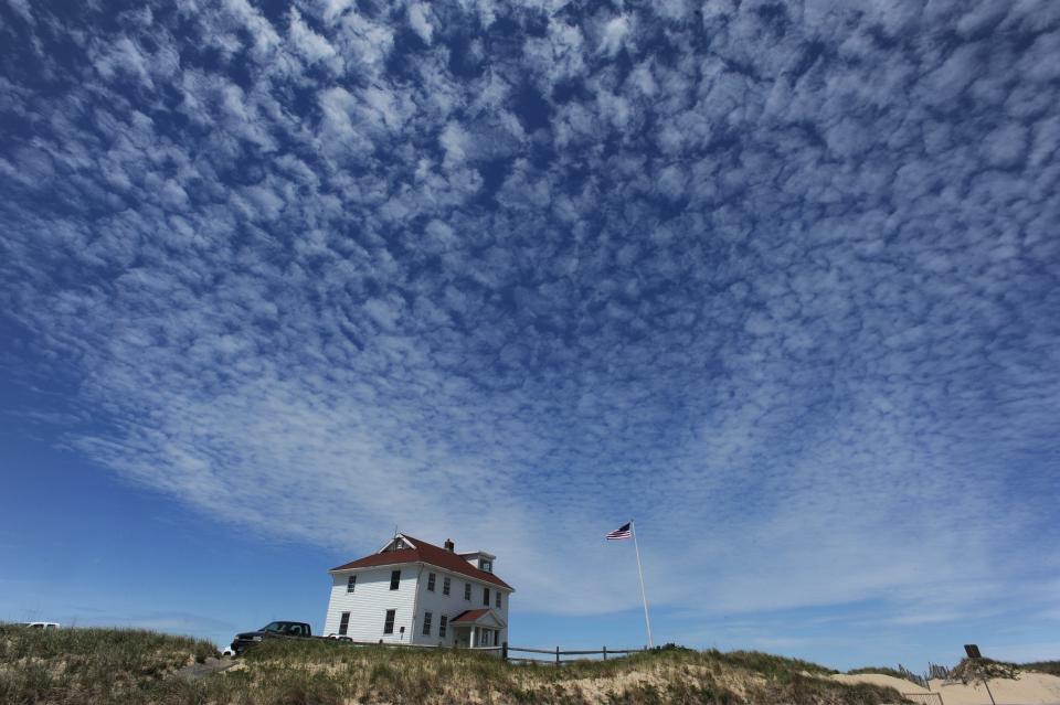 Bright blue skies surround the Cape Cod National Seashore's Race Point Ranger Station in Provincetown in this file photo.