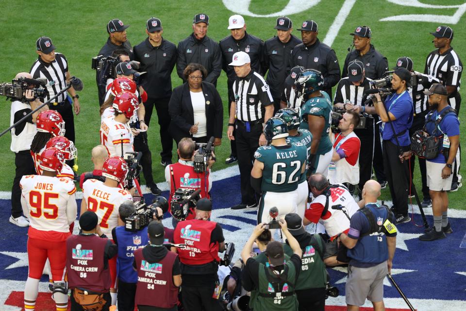 NFL referee Carl Cheffers does the coin toss before Super Bowl 57.