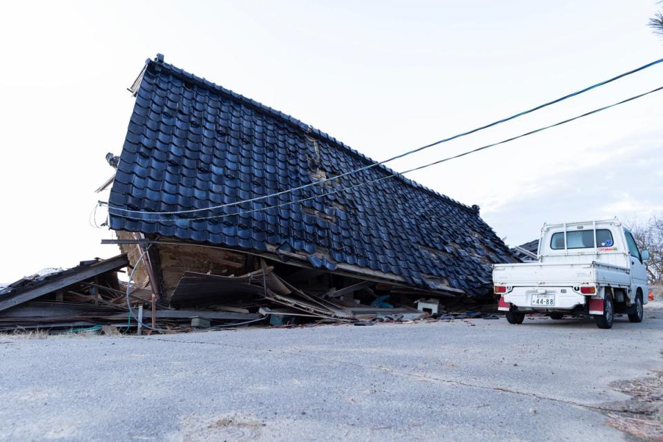 A collapsed house is seen on 2 January, 2024 in Nanao, Japan (Getty Images)