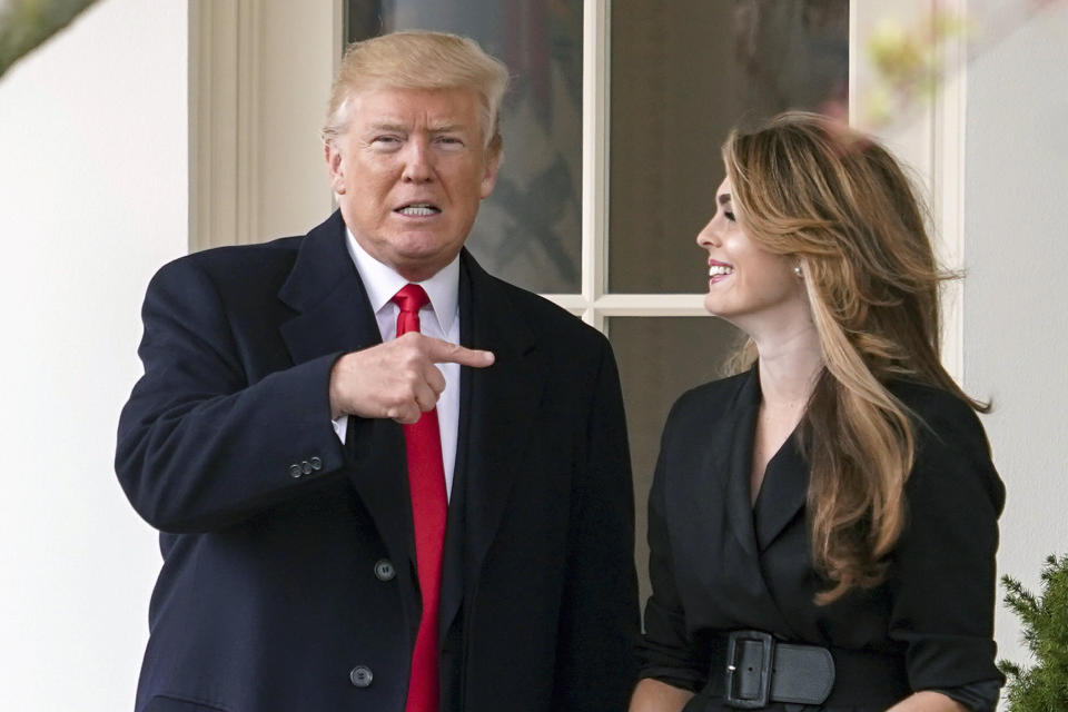 President Donald Trump points to outgoing White House communications director Hope Hicks on her last day before he boards Marine One on the South Lawn of the White House in Washington. (Photo: ASSOCIATED PRESS)