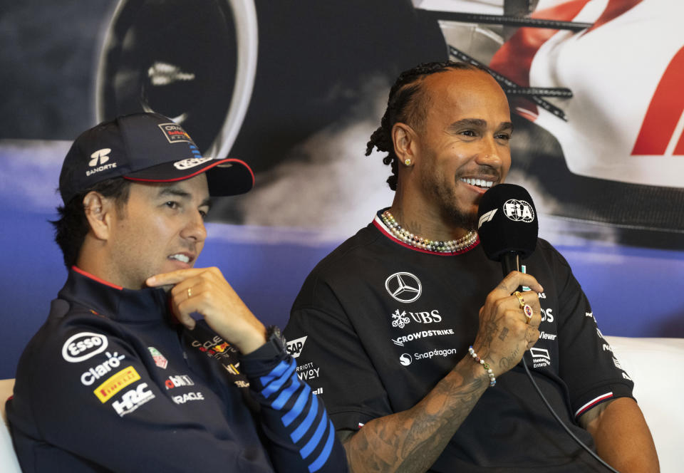 Red Bull Racing driver Sergio Perez, of Mexico, left, and Mercedes driver Lewis Hamilton, of Great Britain, speak during the drivers' press conference at the Canadian Grand Prix auto race Thursday, June 6, 2024, in Montreal. (Christinne Muschi/The Canadian Press via AP)