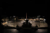 An empty Piazza del Popolo Square is seen in Rome, early Monday, Oct. 26, 2020. Since midnight last Friday and for the next 30 days, people in Lazio are not allowed to leave their homes from midnight to 5 a.m. daily, except to go to or return from work or for other urgent reasons such as health issues. (AP Photo/Alessandra Tarantino)