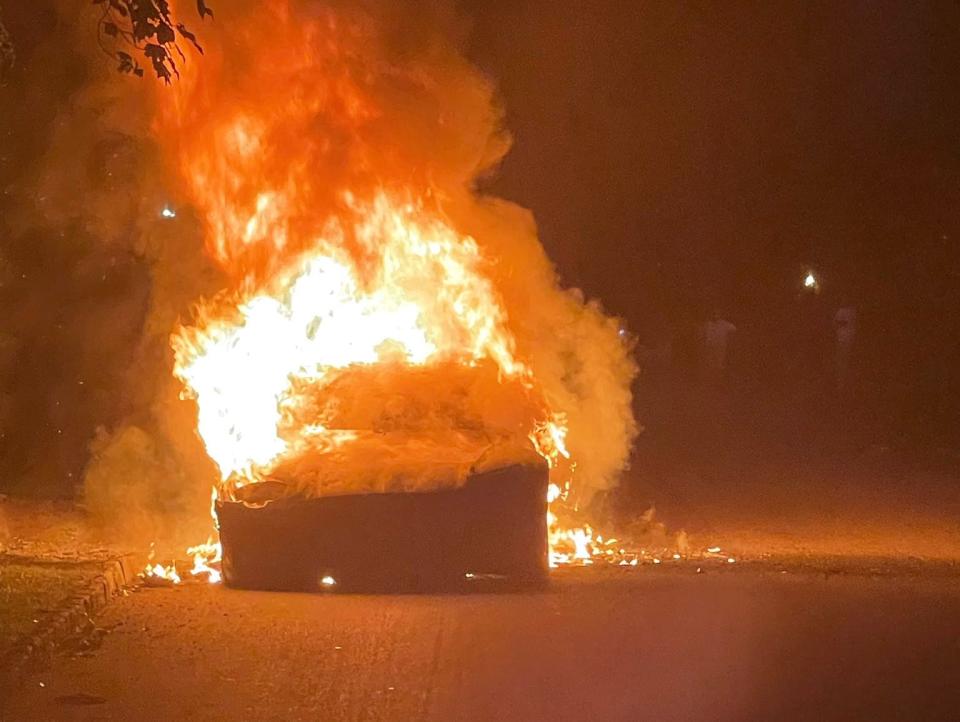 A Tesla Model S Plaid on fire
