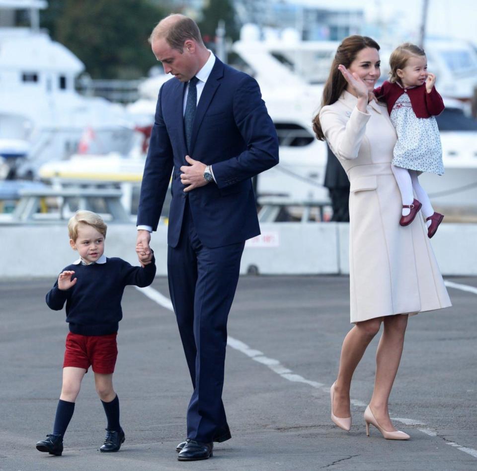 Prince George, Prince William, the Duchess of Cambridge and Princess Charlotte wave at onlookers as they depart from Victoria. Photo: REX/Shutterstock