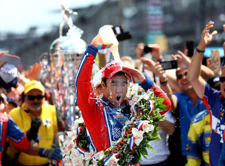 May 28, 2017; Indianapolis, IN, USA; IndyCar Series driver Takuma Sato dumps milk on himself as he celebrates after winning the 101st Running of the Indianapolis 500 at Indianapolis Motor Speedway. Mandatory Credit: Mark J. Rebilas-USA TODAY Sports