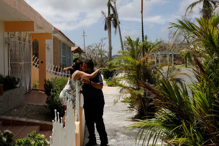 A resident reacts after being given food and water by a volunteer as recovery efforts continue following Hurricane Maria in Ceiba, Puerto Rico, October 4, 2017. REUTERS/Lucas Jackson