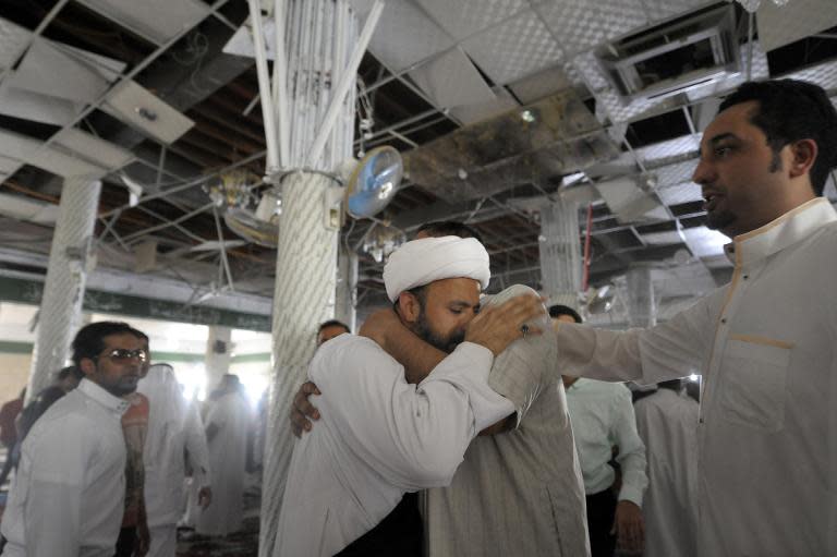 A Saudi man reacts following a blast inside a mosque, in the mainly Shiite Saudi Gulf coastal town of Qatif, 400km east of Riyadh, on May 22, 2015