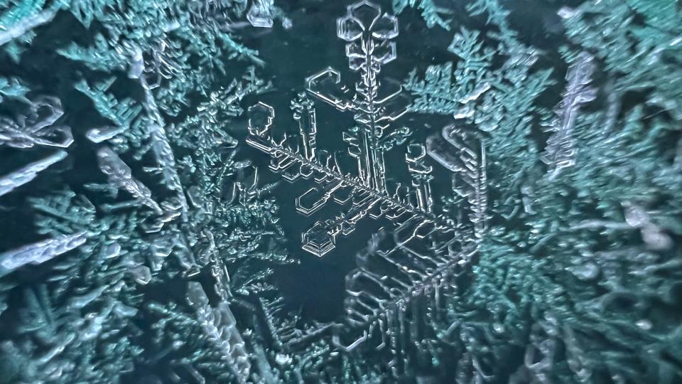 Frost is seen on a windshield of a car in New Philadelphia, as photographed with an iPhone.