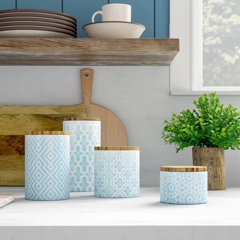 the four cannisters on a countertop