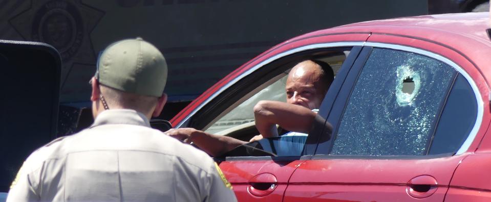 A SWAT team engaged in a standoff with a man refusing to exit a car in the parking lot of an Apple Valley Stater Bros. store near Navajo Road before ultimately being taken into custody on Wednesday afternoon.