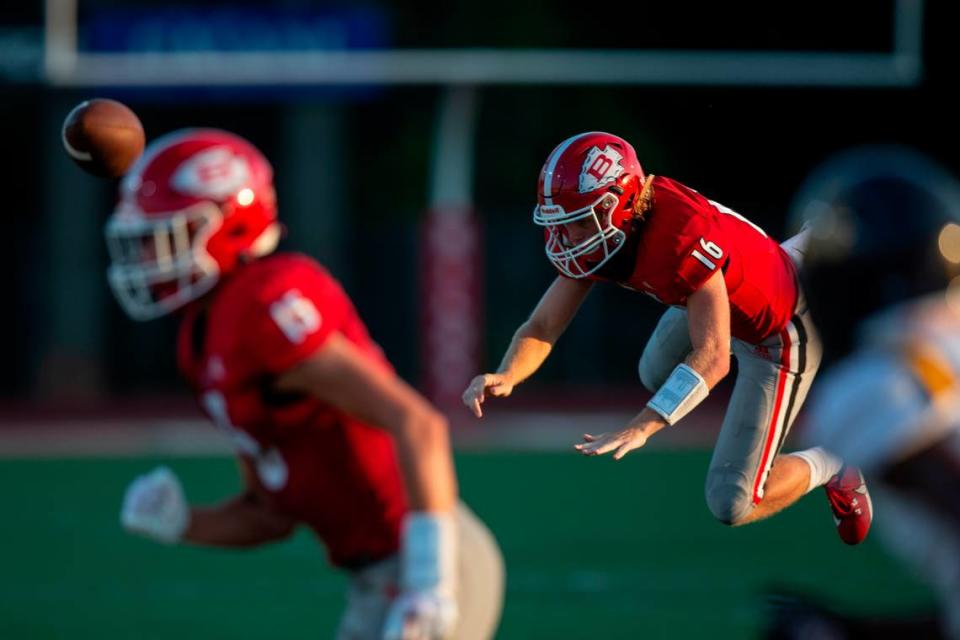 Biloxi quarterback Zachary Marlin gets tackled during a Jamboree game at Biloxi High School on Friday, Aug. 18, 2023.