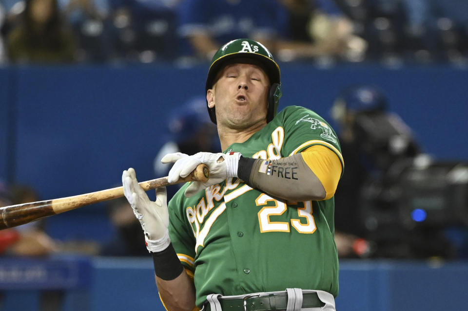 Oakland Athletics' Yan Gomes leans back from an inside pitch thrown by Toronto Blue Jays' Alek Manoah during the fourth inning of a baseball game Friday, Sept. 3, 2021, in Toronto. (Jon Blacker/The Canadian Press via AP