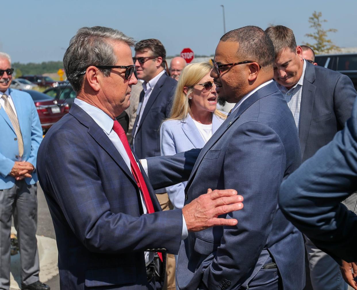 Georgia Governor Brian Kemp talks with Georgia State Senator Derek Mallow at the official grand opening for the Savannah Amazon Fulfilment Center SAV4 on Monday, September 18, 2023.