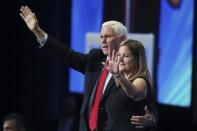 Former vice president Mike Pence and his wife Karen wave after he spoke during the Road to Majority convention at Gaylord Palms Resort & Convention Center in Kissimmee, Fla., on Friday, June 18, 2021. (Stephen M. Dowell/Orlando Sentinel via AP)