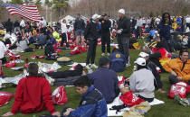 FILE - Runners rest up in the Hopkinton, Mass., Athletes' Village, Monday, April 17, 2006, before the start of the 110th Boston Marathon. Once a year for the last 100 years, Hopkinton becomes the center of the running world, thanks to a quirk of geography and history that made it the starting line for the world's oldest and most prestigious annual marathon. (AP Photo/Bizuayehu Tesfaye, File)