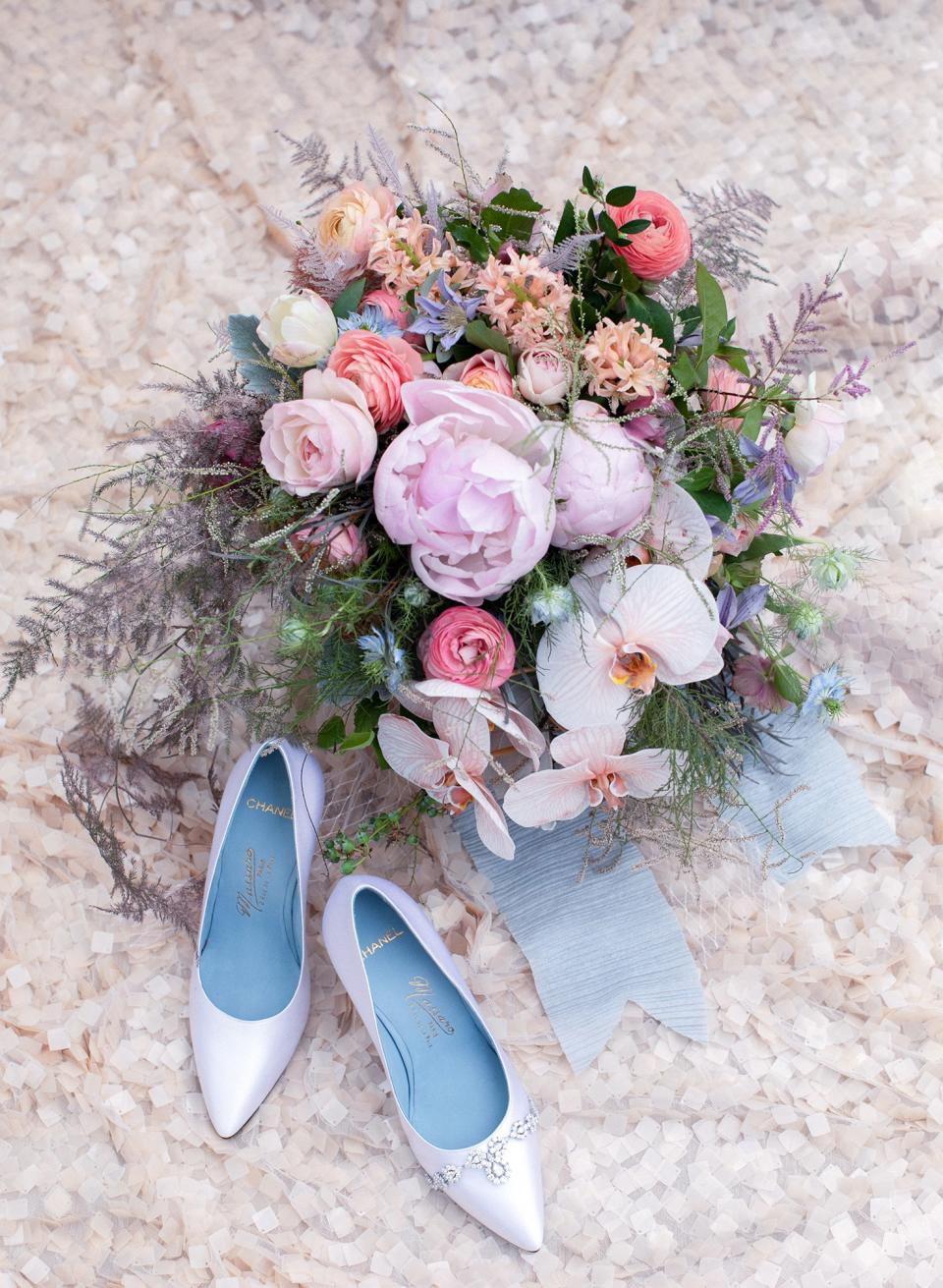 A gift from my parents—a diamond necklace—resting on my custom Chanel haute couture shoes and placed beside my bridal bouquet, by my absolute favorite florist Kiana “Tulipina” Underwood. In Persian culture, parents and family of the bride usually gift her precious stones and jewelry on her wedding day.