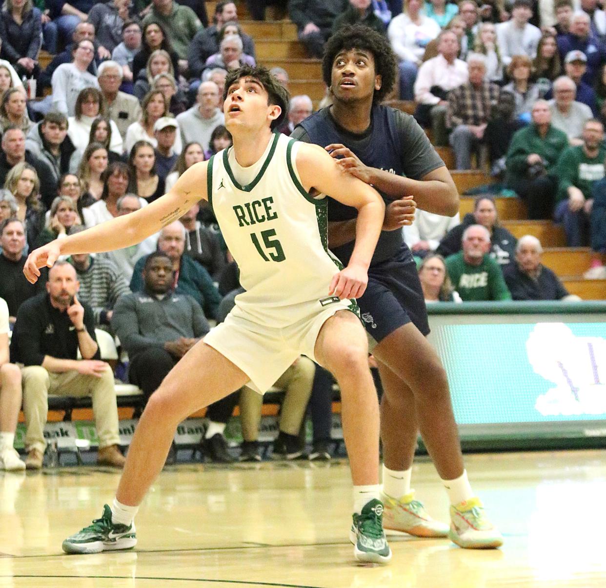 Rice's Drew Bessette and Burlington's Henry Tornwini battle for position during the Green Knights 66-63 win over the Seahorses in the 2024 D1 State Championship game at UVM's Patrick Gym.