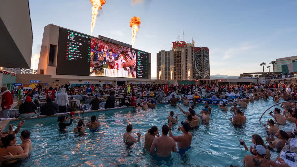 San Francisco 49ers fans celebrate a touchdown as they watch the Super Bowl 58 NFL football game against the Kansas City Chiefs from a pool on top of the Circa Resort and Casino, Sunday, Feb. 11, 2024, in Las Vegas. - Gregory Bull/AP