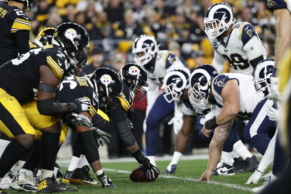 FILE - In this Nov. 10, 2019, file photo, the Pittsburgh Steelers offense, left, lines up against the Los Angeles Rams' defense during the first half of an NFL football game in Pittsburgh. The NFL's decision to expand the playoffs from 12 to 14 teams this season could have a major impact on the league based on how things have played out in the past.(AP Photo/Don Wright, File)