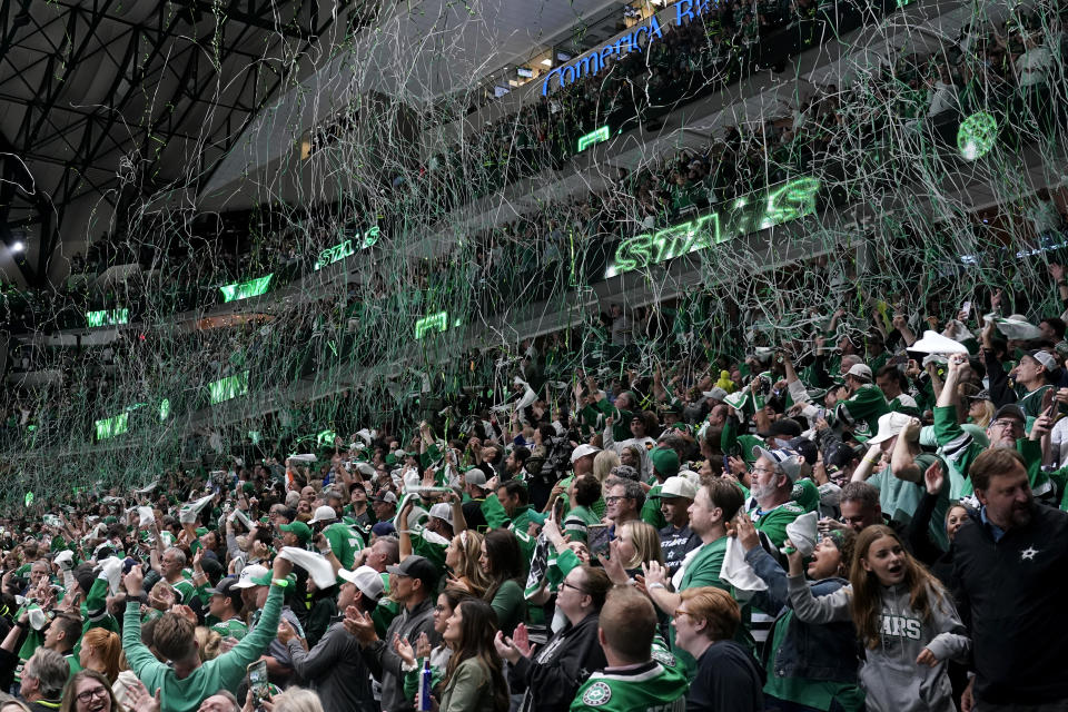 Fans cheer as streamers fall after the Dallas Stars won Game 4 of the NHL hockey Stanley Cup Western Conference finals in overtime against the Vegas Golden Knights, Thursday, May 25, 2023, in Dallas. (AP Photo/Tony Gutierrez)