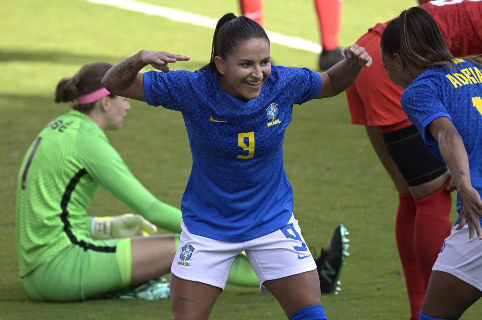 Brazil forward Debinha (9) celebrates after scoring a goal past Canada goalkeeper Stephanie Labbe (1) during the first half of a SheBelieves Cup women's soccer match, Wednesday, Feb. 24, 2021, in Orlando, Fla. (AP Photo/Phelan M. Ebenhack)