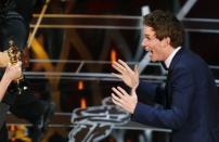 Actor Eddie Redmayne reacts as he takes the stage to accept the Oscar for best actor for his role in "The Theory of Everything" during the 87th Academy Awards in Hollywood, California February 22, 2015. REUTERS/Mike Blake