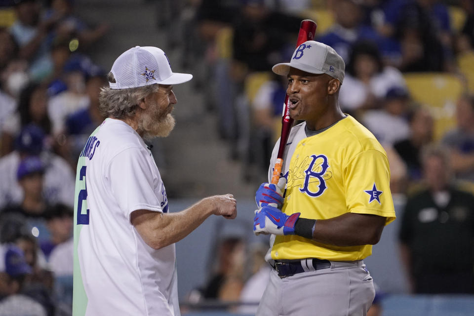 Actor Bryan Cranston, left, talks to former Texas Rangers player Adrian Beltre during the MLB All Star Celebrity Softball game, Saturday, July 16, 2022, in Los Angeles. (AP Photo/Mark J. Terrill)