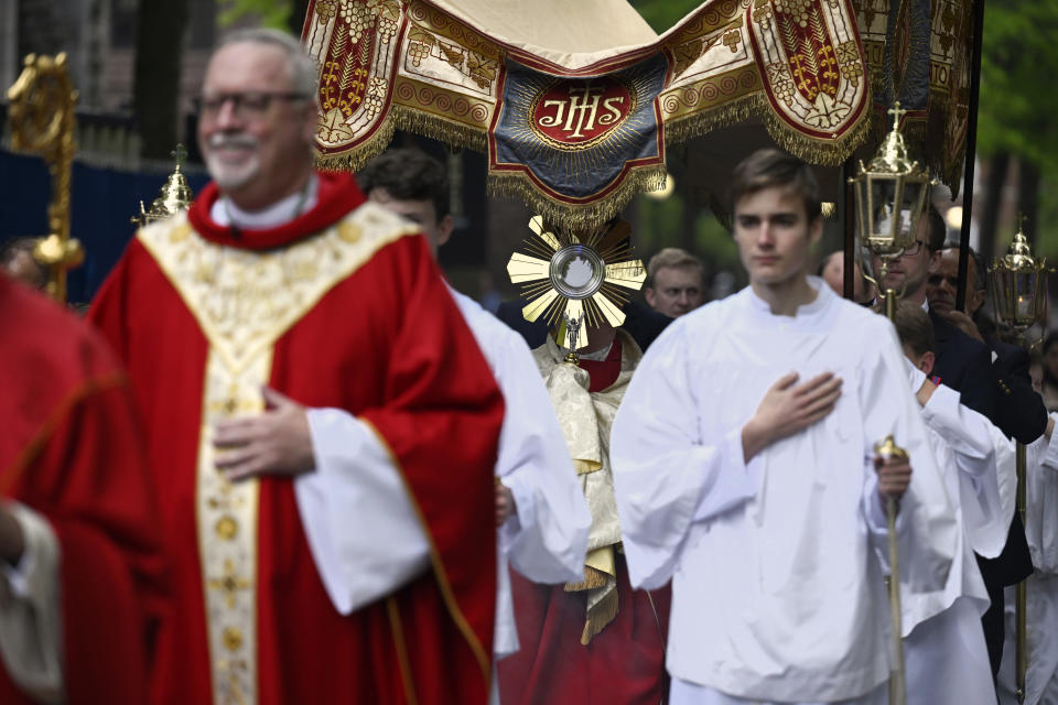 The Eucharistic host is held in a monstrance during a procession outside of St. Mary's Church, Saturday, May 18, 2024, in New Haven, Conn. The Eucharistic Procession from St. Mary's Church is one of four pilgrimage routes crossing the country and converging at the National Eucharistic Congress in Indianapolis, July 16. (AP Photo/Jessica Hill)