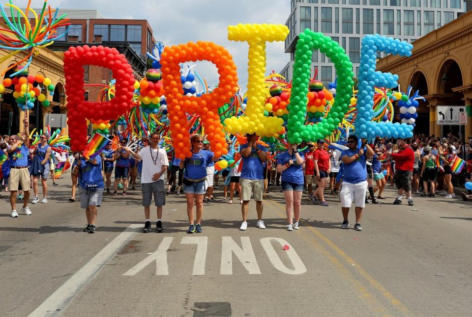 Members of the L Brands group carry balloons during the 2017 Stonewall Columbus Pride Parade in Columbus, Ohio on June 17, 2017.