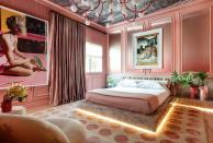 <p>For this Italian-contessa-meets-Palm-Beach guest suite, <a href="https://ninamagon.com/" rel="nofollow noopener" target="_blank" data-ylk="slk:Magon;elm:context_link;itc:0;sec:content-canvas" class="link ">Magon</a> created a custom bed upholstered in velvet by <a href="https://fabricut.com/sharris/fabric/1317301/lilith-ombre/rose-quartz" rel="nofollow noopener" target="_blank" data-ylk="slk:Fabricut;elm:context_link;itc:0;sec:content-canvas" class="link ">Fabricut</a> and framed in <a href="https://www.cosentino.com/usa/colors/dekton/taga/" rel="nofollow noopener" target="_blank" data-ylk="slk:Taga Dekton;elm:context_link;itc:0;sec:content-canvas" class="link ">Taga Dekton</a> by <a href="https://www.cosentino.com/usa/" rel="nofollow noopener" target="_blank" data-ylk="slk:Cosentino;elm:context_link;itc:0;sec:content-canvas" class="link ">Cosentino</a>. The rug is by New Moon, the chandelier is a custom color from <a href="https://www.studiomlighting.com/" rel="nofollow noopener" target="_blank" data-ylk="slk:Studio M;elm:context_link;itc:0;sec:content-canvas" class="link ">Studio M</a>, and the art is from <a href="https://www.holdenluntz.com/" rel="nofollow noopener" target="_blank" data-ylk="slk:Holden Luntz Gallery;elm:context_link;itc:0;sec:content-canvas" class="link ">Holden Luntz Gallery</a>.</p>