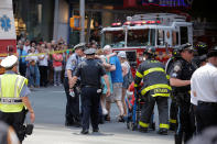 <p>First responders tend to injured pedestrians after a vehicle struck pedestrians on a sidewalk in Times Square in New York on May 18, 2017. (Lucas Jackson/Reuters) </p>