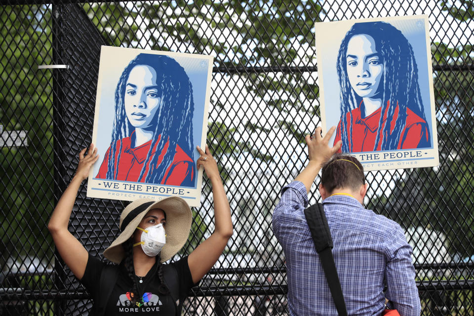 Demonstrators protest Friday, June 5, 2020, near the White House in Washington, over the death of George Floyd, a black man who was in police custody in Minneapolis. Floyd died after being restrained by Minneapolis police officers. (AP Photo/Manuel Balce Ceneta)