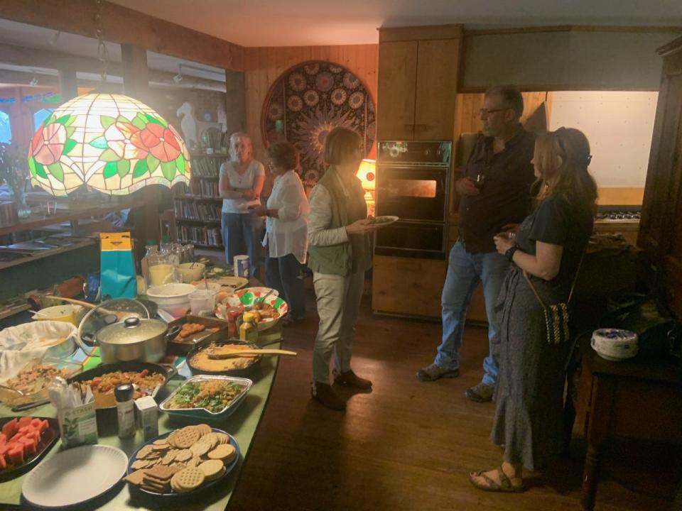 "It's important that we keep this sense of being together on something. I think that's what these potlucks do," said Azule founder Camille Shafer. Earlier this month, the nonprofit arts residency celebrated the founder's 80th birthday, the second potluck gathering held at the Trust property since COVID shut the gatherings down.