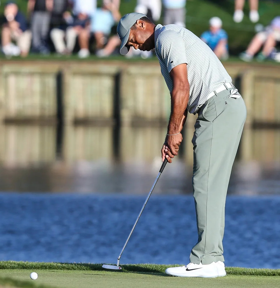 Tiger Woods putts for birdie at the 17th hole during the first round of the 2019 Players Championship. It was the last time he competed in the PGA Tour's marquee event.