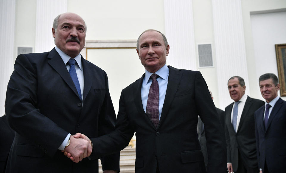 Alexander Lukashenko and Vladimir Putin shake hands during a meeting at the Kremlin in Moscow (Alexander Nemenov / AFP via Getty Images file)