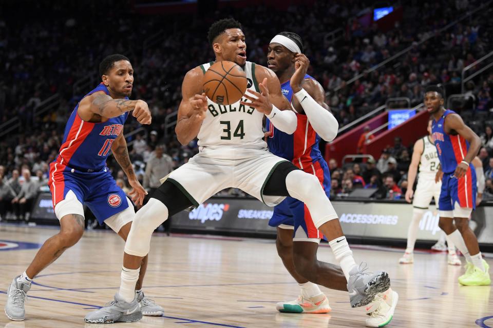 Bucks forward Giannis Antetokounmpo's drives to the basket against Pistons guard Rodney McGruder, left, and center Jalen Duran in the third quarter of the Pistons' 150-130 loss on Monday, Jan. 23, 2023, at Little Caesars Arena.