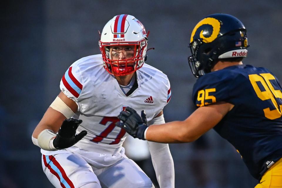 Arrowhead offensive lineman Garrett Sexton (71) drops into pass protection against Marquette defensive lineman Tate Kowalik in a game Thursday, August 17, 2023, at Hart Park in Wauwatosa, Wisconsin.